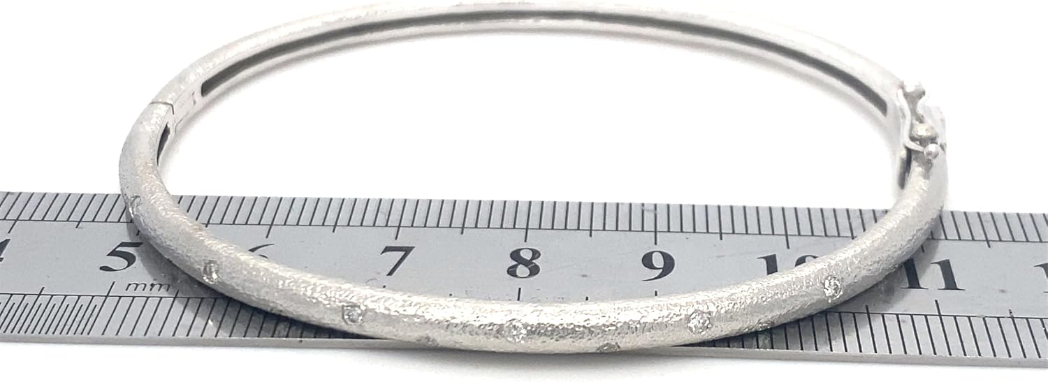 Matte finished hammered gold 14k gold hinged bangle with flush set diamonds in yellow, white or rose gold