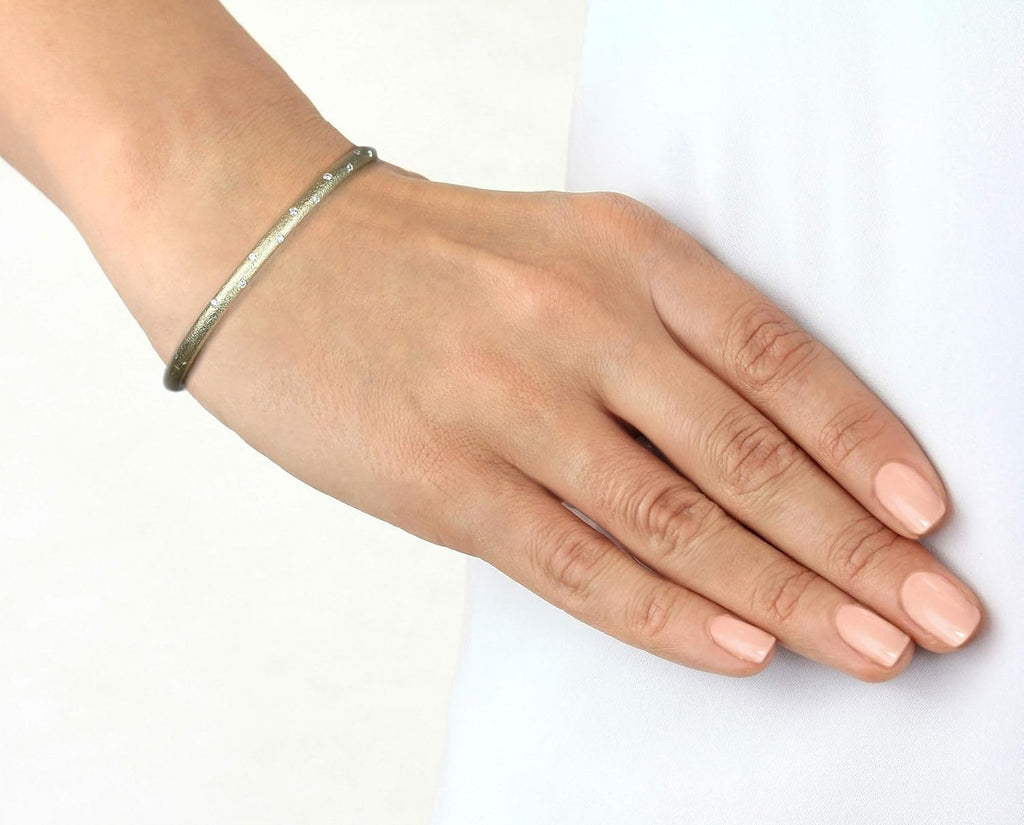 Matte finished hammered gold 14k gold hinged bangle with flush set diamonds in yellow, white or rose gold