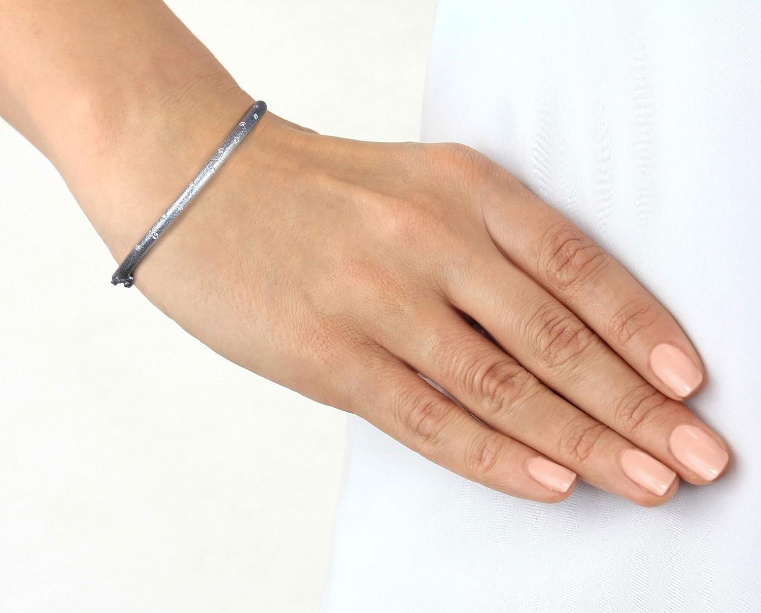 Matte finished hammered gold 14k gold hinged bangle with flush set diamonds in yellow, white or rose gold